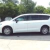 White Chrysler Voyager with Driverge Rear Entry Manual Fold Out conversion