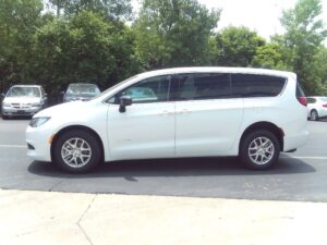 White Chrysler Voyager with Driverge Rear Entry Manual Fold Out conversion