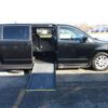 Black Dodge Grand Caravan with Driverge Side Entry Automatic Fold Out conversion