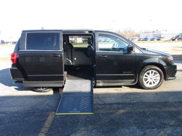 Black Dodge Grand Caravan with Driverge Side Entry Automatic Fold Out conversion