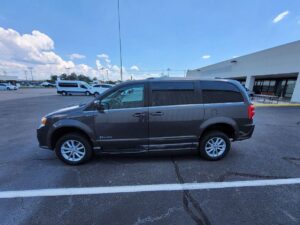 Grey Dodge Grand Caravan with BraunAbility Side Entry Automatic Fold Out conversion