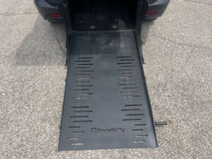 Black Chrysler Voyager with BraunAbility Rear Entry Manual Fold Out conversion