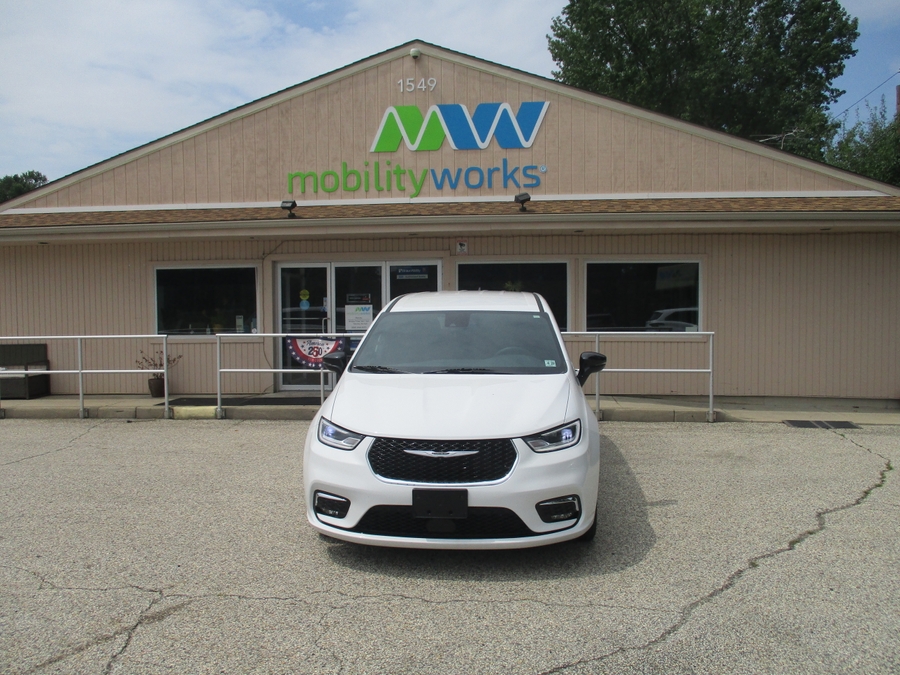 White Chrysler Pacifica with Driverge Side Entry Automatic Fold Out conversion