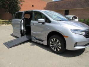 Silver Honda Odyssey with BraunAbility Side Entry Automatic In Floor conversion