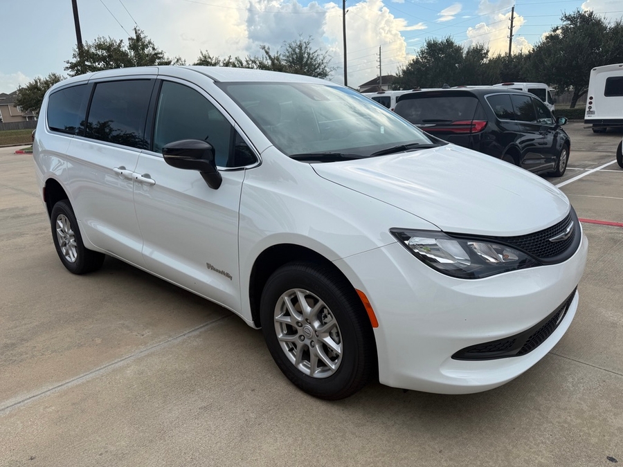 White Chrysler Voyager with BraunAbility Rear Entry Manual Fold Out conversion