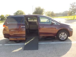 Red Honda Odyssey with Vantage Mobility Side Entry Automatic In Floor conversion