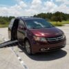 Red Honda Odyssey with BraunAbility Side Entry Automatic Fold Out conversion