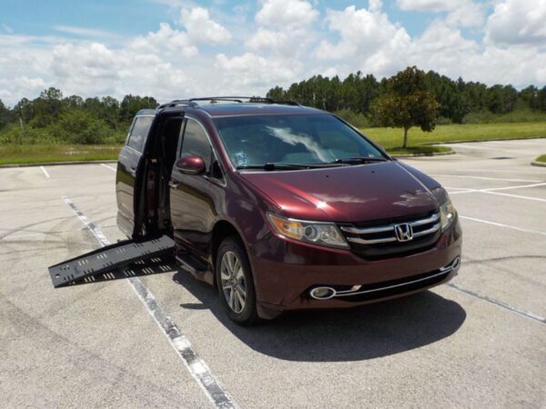 Red Honda Odyssey with BraunAbility Side Entry Automatic Fold Out conversion