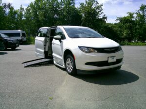 White Chrysler Voyager with BraunAbility Side Entry Automatic Fold Out conversion