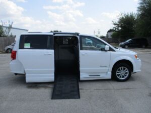 White Dodge Grand Caravan with BraunAbility Side Entry Automatic Fold Out conversion