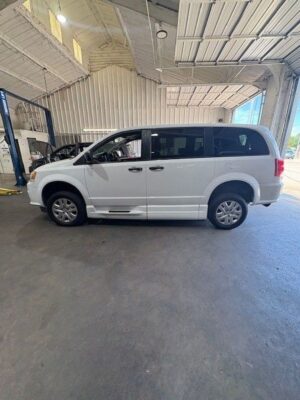 White Dodge Grand Caravan with BraunAbility Side Entry Manual Fold Out conversion