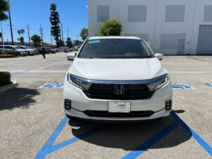 White Honda Odyssey with BraunAbility Side Entry Automatic In Floor conversion