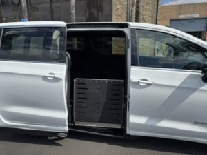 White Chrysler Pacifica with Driverge Side Entry Automatic Fold Out conversion