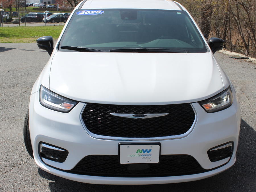 White Chrysler Pacifica with Adaptive Vans Rear Entry Manual Fold Out conversion
