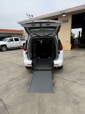 White Chrysler Voyager with Driverge Rear Entry Manual Fold Out conversion