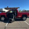Red Chevrolet Silverado 2500HD with ATC Side Entry Automatic Fold Out conversion