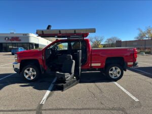 Red Chevrolet Silverado 2500HD with ATC Side Entry Automatic Fold Out conversion
