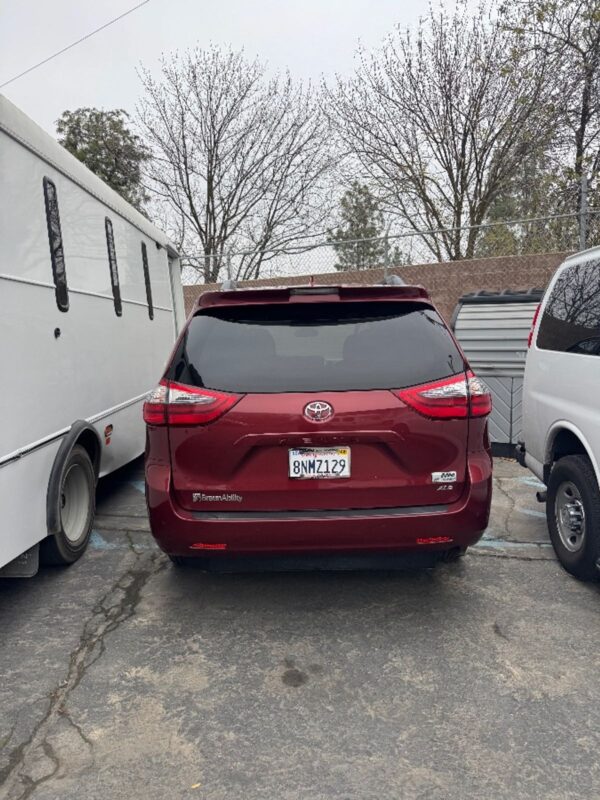 Red Toyota Sienna with BraunAbility Side Entry Automatic Fold Out conversion