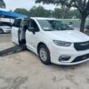 White Chrysler Pacifica with Driverge Side Entry Automatic Fold Out conversion