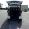 White Chrysler Voyager with Driverge Rear Entry Manual Fold Out conversion
