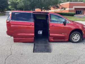 Red Chrysler Pacifica with BraunAbility Side Entry Automatic Fold Out conversion