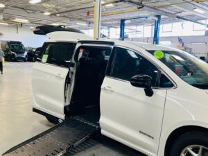 White Chrysler Pacifica with Driverge Side Entry Automatic Fold Out conversion