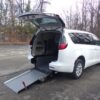 White Chrysler Voyager with Driverge Rear Entry Manual Fold Out conversion