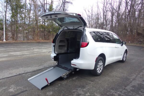 White Chrysler Voyager with Driverge Rear Entry Manual Fold Out conversion