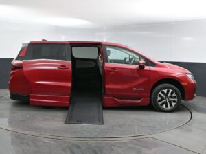 Red Honda Odyssey with BraunAbility Side Entry Automatic In Floor conversion