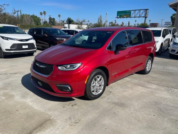 Red Chrysler Pacifica with Driverge Side Entry Automatic Fold Out conversion