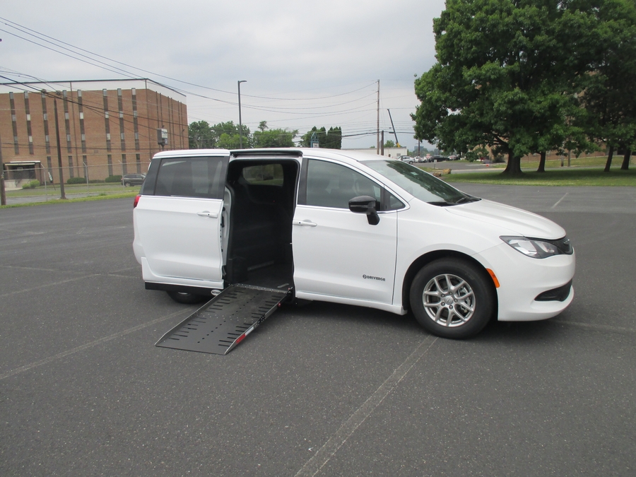 White Chrysler Voyager with Driverge Side Entry Automatic Fold Out conversion