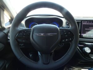 White Chrysler Pacifica with Driverge Side Entry Automatic Fold Out conversion