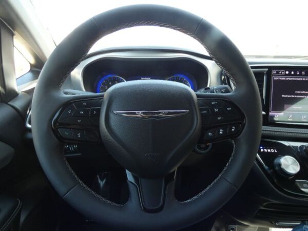 White Chrysler Pacifica with Driverge Side Entry Automatic Fold Out conversion