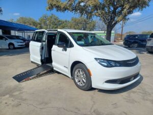 White Chrysler Voyager with Driverge Side Entry Automatic Fold Out conversion