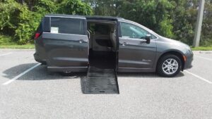 Grey Chrysler Voyager with BraunAbility Side Entry Manual Fold Out conversion