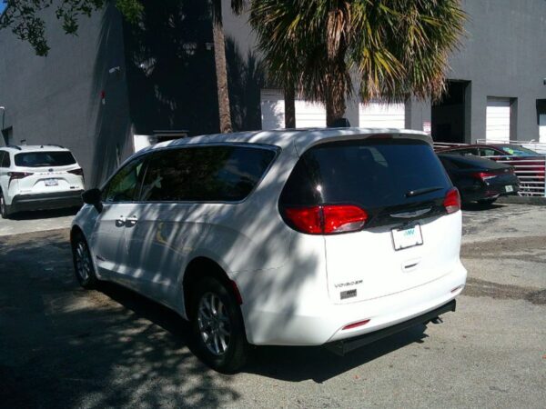 White Chrysler Voyager with Driverge Side Entry Automatic Fold Out conversion