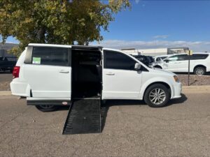 White Dodge Grand Caravan with Adaptive Vans Side Entry Automatic Fold Out conversion