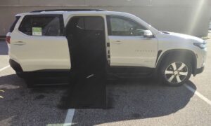 White Chevrolet Traverse with BraunAbility Side Entry Automatic In Floor conversion