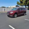 Red Chrysler Pacifica with BraunAbility Side Entry Automatic In Floor conversion
