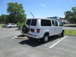 White Ford Econoline with Norcal Side Entry Automatic Fold Out conversion