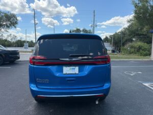 Blue Chrysler Pacifica with BraunAbility Side Entry Automatic Fold Out conversion