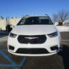 White Chrysler Pacifica with Driverge Side Entry Automatic Fold Out conversion
