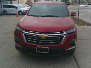 Red Chevrolet Traverse with BraunAbility Side Entry Automatic In Floor conversion