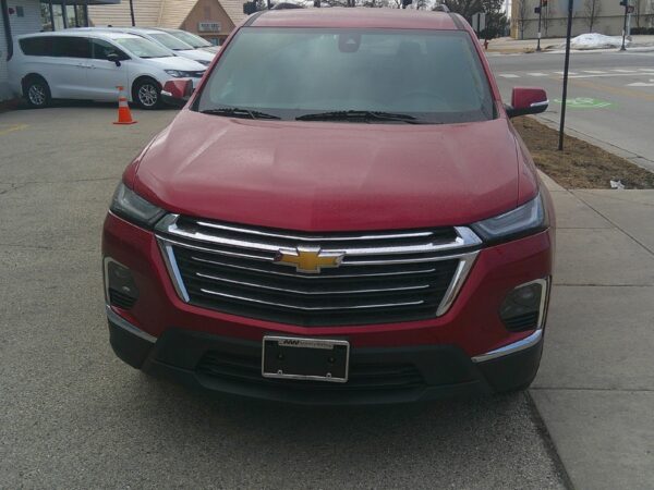 Red Chevrolet Traverse with BraunAbility Side Entry Automatic In Floor conversion