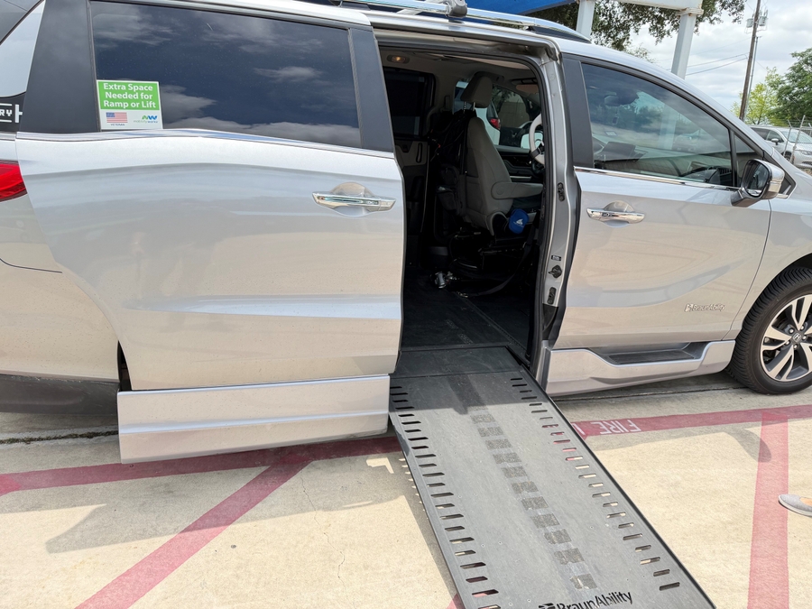 Silver Honda Odyssey with BraunAbility Side Entry Automatic In Floor conversion