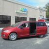 Red Chrysler Pacifica with Driverge Side Entry Automatic Fold Out conversion