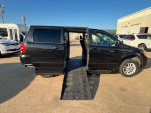 Black Dodge Grand Caravan with BraunAbility Side Entry Automatic Fold Out conversion