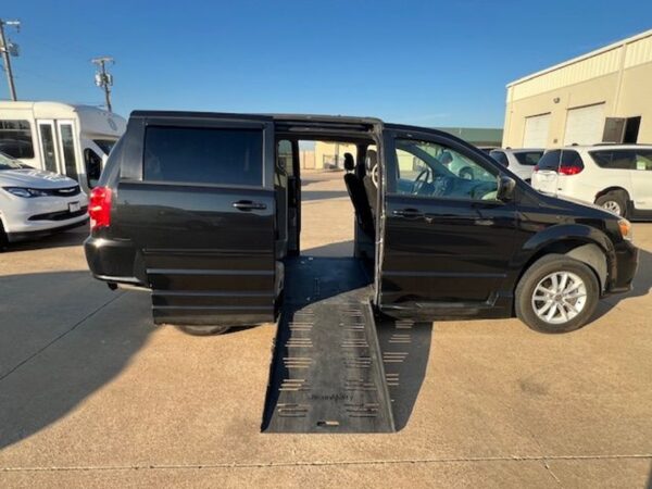 Black Dodge Grand Caravan with BraunAbility Side Entry Automatic Fold Out conversion