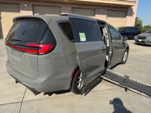 Grey Chrysler Pacifica with Adaptive Vans Side Entry Automatic Fold Out conversion