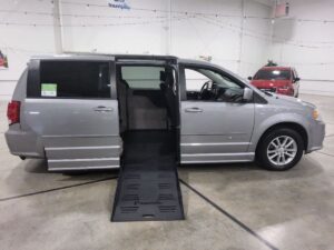 Silver Dodge Grand Caravan with BraunAbility Side Entry Automatic Fold Out conversion